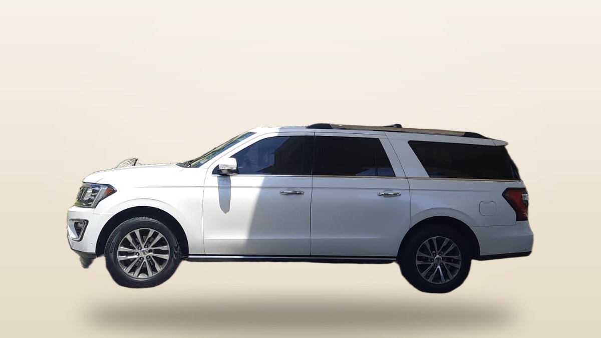 White Ford Expedition SUV from our own fleet